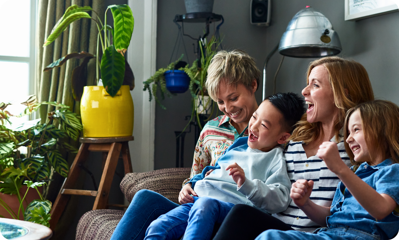 Parents laughing with their kids.